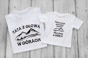 Tata_i_dziecko_z_głową_w_górach.webp