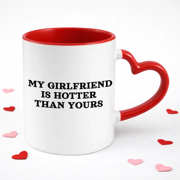 bialy-kubek-z-uchwytem-serce-my-girlfriend-is-hotter-than-yours.webp
